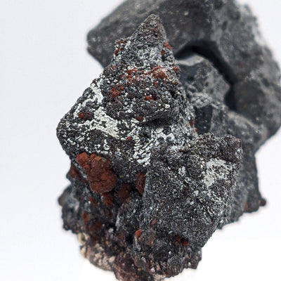 Angled view of Martite pseudomorph crystal cluster with metallic luster