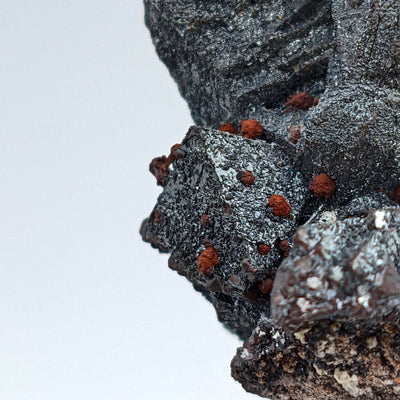 Close-up of hematite crystal edge with red iddingsite nodules, Malargüe, Argentina