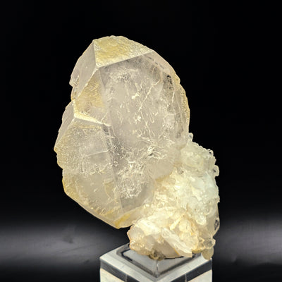 Side view of tabular baryte crystal cluster on display stand