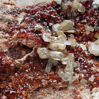 Diopside crystal cluster on hessonite garnet matrix from Bellecombe, Italy