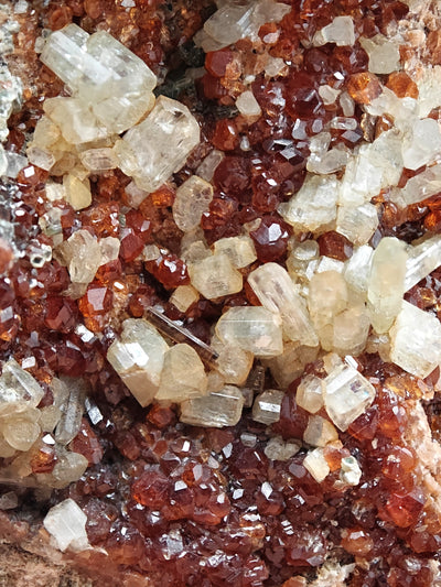 Close-up of intergrown diopside and hessonite garnet crystals from Bellecombe, Italy
