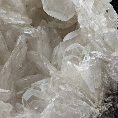 Cluster of milky-white colemanite crystals showing sharp crystal faces
