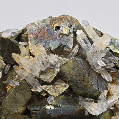 Quartz crystal sprays on iridescent arsenopyrite matrix, Julcani Mine