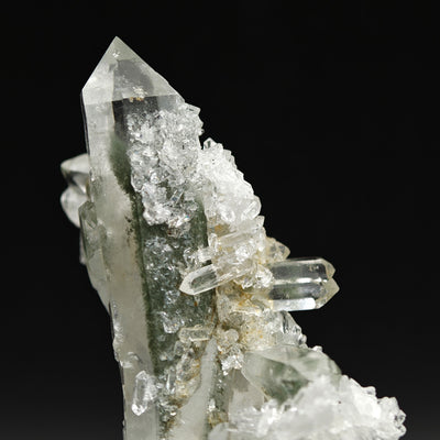 Side view of quartz crystal with chlorite phantom and smaller attached crystals