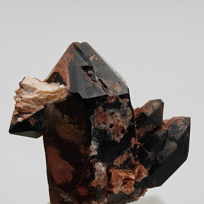 Side view of morion quartz scepter crystal with white Halite patch