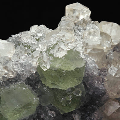 Detail of green Fluorite crystal surrounded by Calcite and sparkling Quartz
