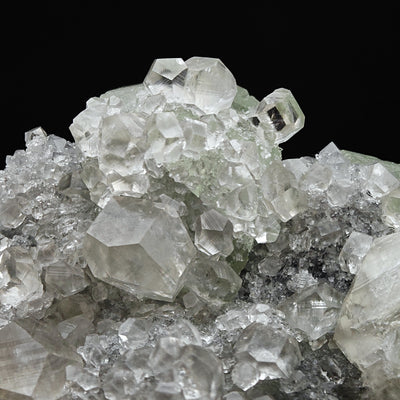 Cluster of sharp Calcite crystals with drusy Quartz coating on matrix