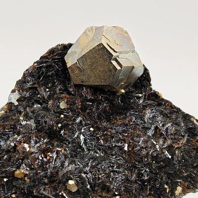 Side view of pyrite crystal perched on hematite crystals, Rio Mine