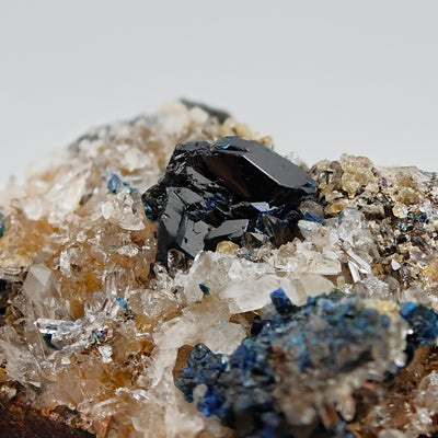 Detail of lustrous lazulite crystal faces on sparkling quartz, Rapid Creek, Yukon