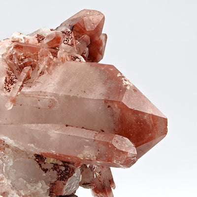 Close-up of hematoid quartz crystal edge showing translucent white quartz with red inclusions, Orange River, South Africa