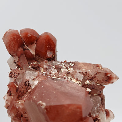 Close-up of multiple doubly terminated hematoid quartz floater crystals, Orange River, South Africa