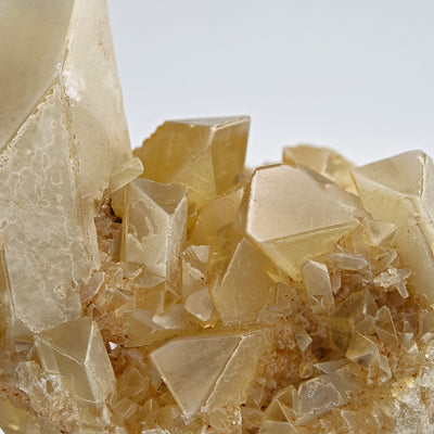 Detail of golden Baryte crystals showing sharp dipyramidal terminations