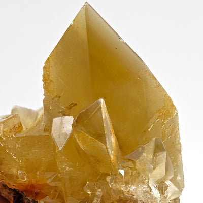 Close-up of Baryte crystal apex showing golden color and transparency