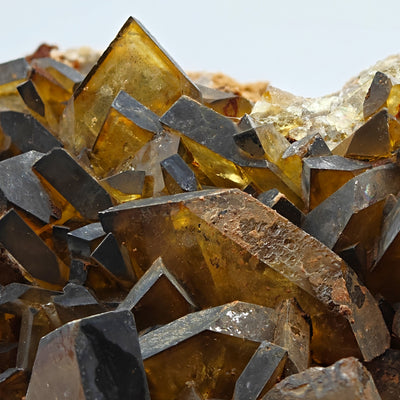 Close-up of intergrown baryte crystals with matrix in background, Sardinia