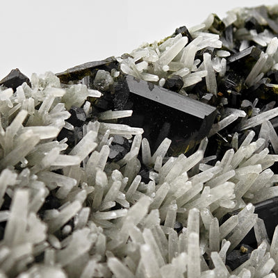Detail of tabular epidote crystal nestled in quartz crystal cluster, Iran