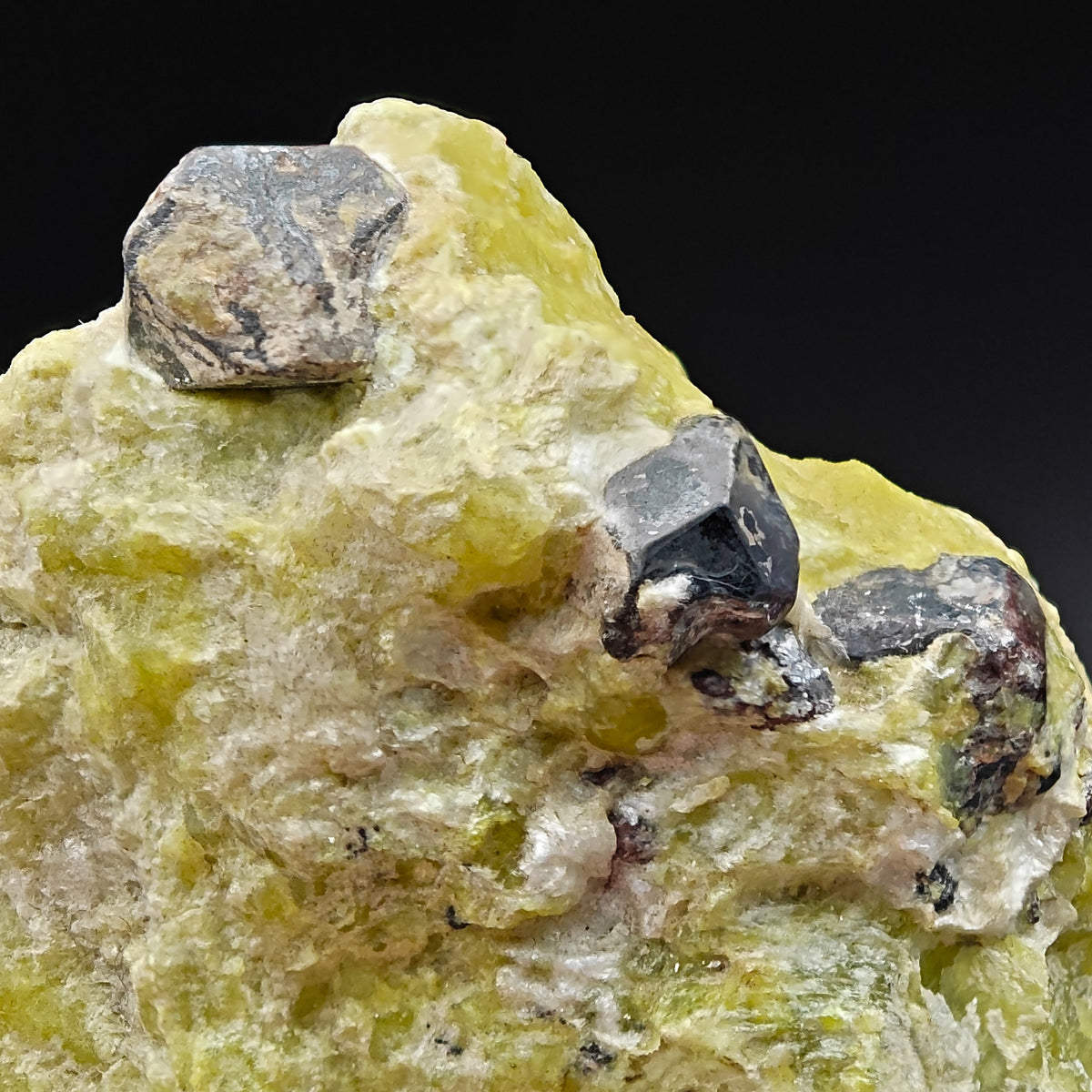 Martite octahedral crystals on bright yellow Lizardite matrix from Snarum, Norway