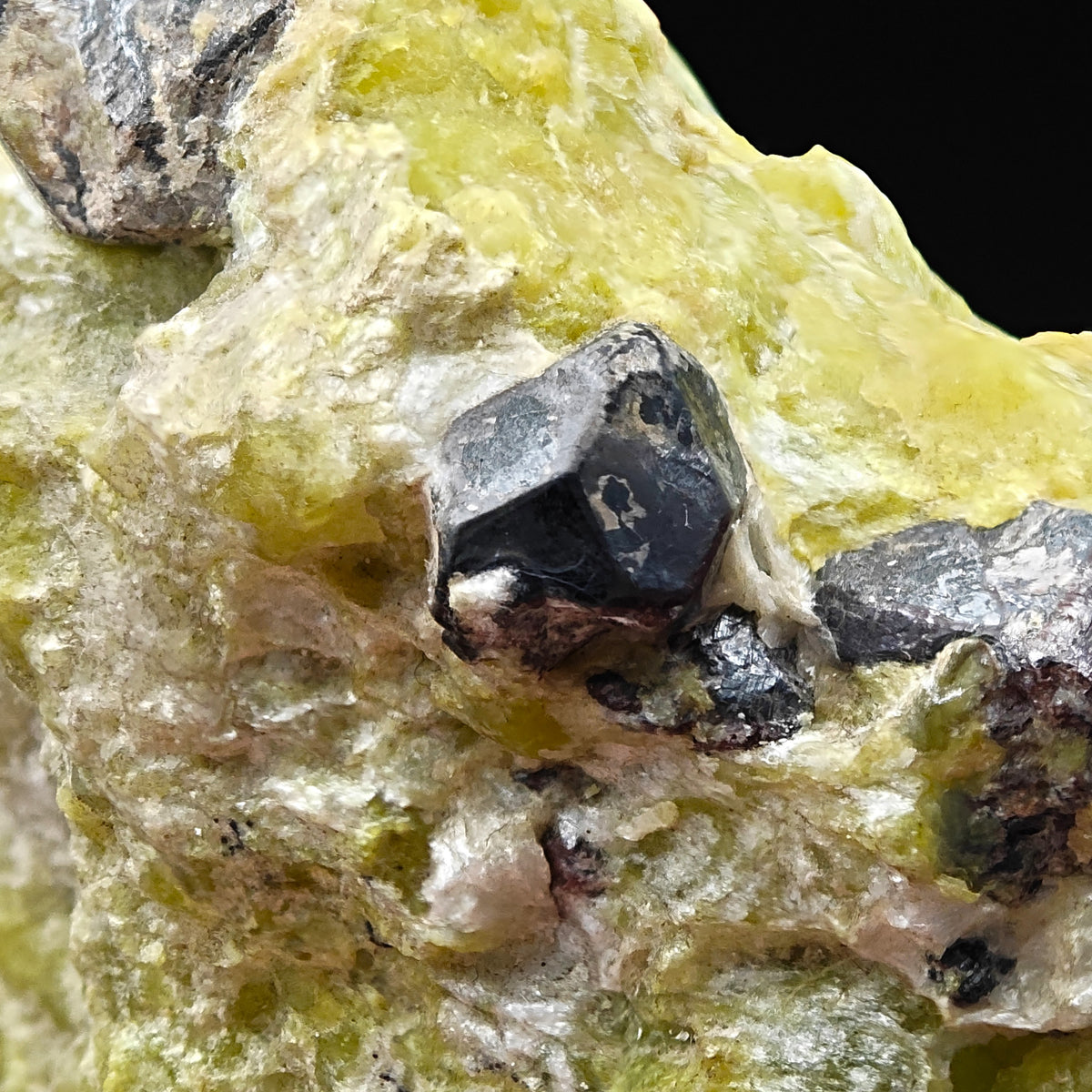 Detail of glossy Martite crystal face showing metallic luster, Snarum, Norway