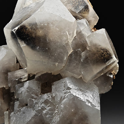 Close-up of calcite crystals with matrix contact and iron staining, Sardinia