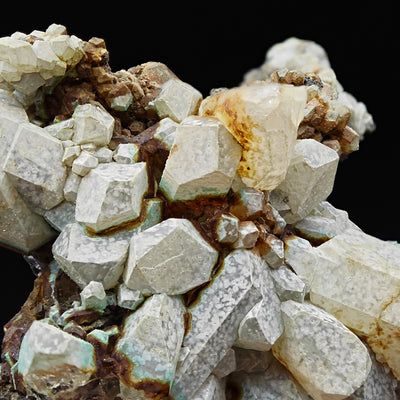 Detail of Anglesite crystals showing vitreous luster and matrix contact