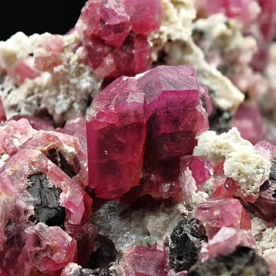 Detail of an isolated Rosolite Garnet crystal group on matrix, Mexico