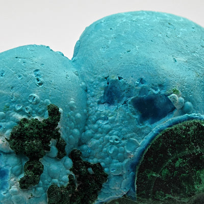 Detail of smooth rounded chrysocolla botryoids showing dark blue cavity