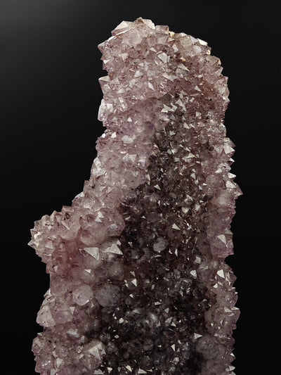 Close-up of pointed Amethyst crystal terminations at the top of the cluster