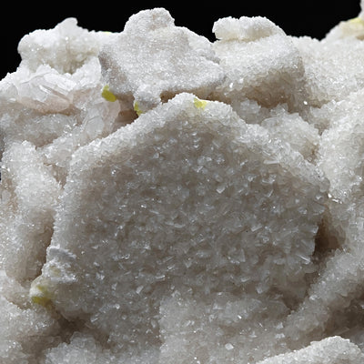 Detail of sugary white aragonite crystal clusters with hexagonal twin outlines