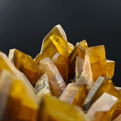 Close-up of baryte crystal tips showing vitreous luster and amber tone