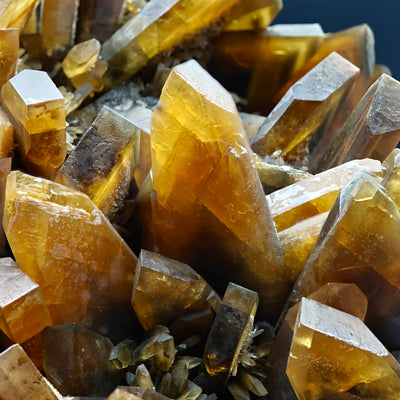 Detail of translucent amber baryte crystals with sharp terminations