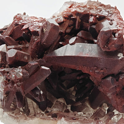 Close-up of terminated hematoid quartz crystals showing brick-red coloration