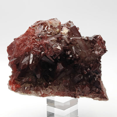 Back view of hematoid quartz cluster on display stand, Tinejdad, Morocco