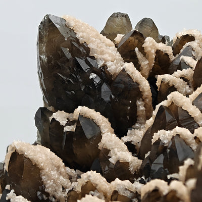 Close-up of a smoky quartz crystal tip with pink dolomite crust, Cavnic Mine, Romania