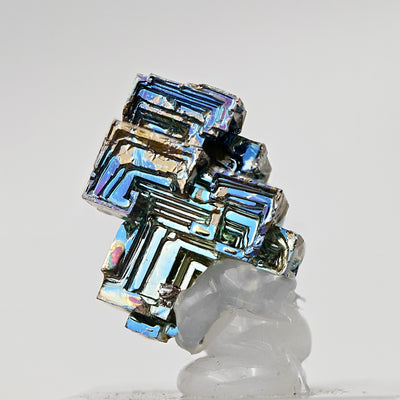 Bismuth crystal displayed at angle revealing recessed terraced structure