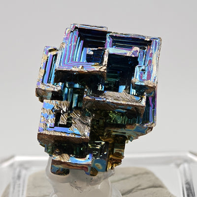 Close-up of bismuth crystal staircase formations with metallic oxide colors