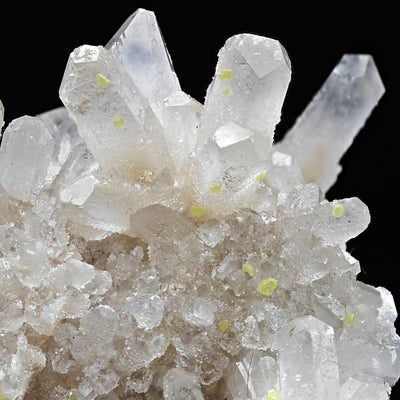 Macro view of Celestine crystal faces with scattered yellow Sulfur spots