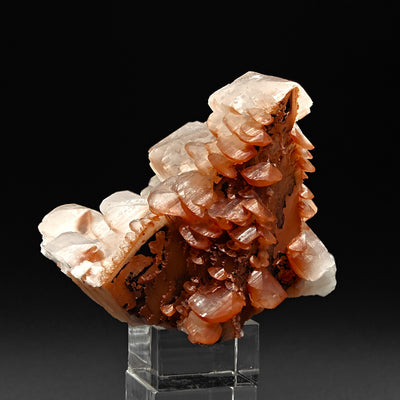 Calcite specimen showing tiered pagoda growth with brick-red hematite banding, Hubei, China