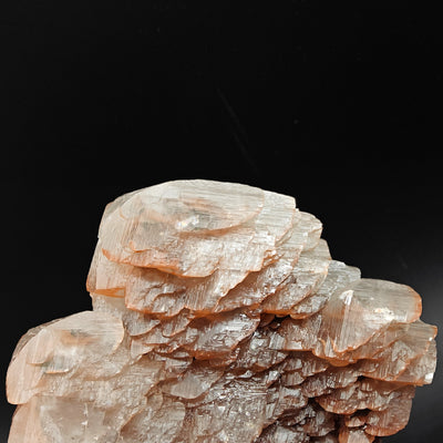 Close-up of calcite crystal faces with brick-red hematite inclusions, Fengjiashan Mine