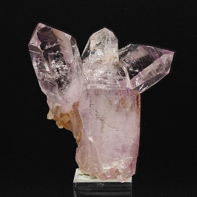 Amethyst cluster displayed upright showing deep purple color zoning
