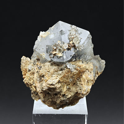 Quartz paramorph bipyramidal crystal on matrix mounted on acrylic stand
