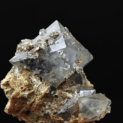 Detail of bipyramidal quartz paramorph crystal faces with small crystal inclusions