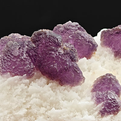 Close-up of sugar-textured purple fluorite crystals showing granular surface