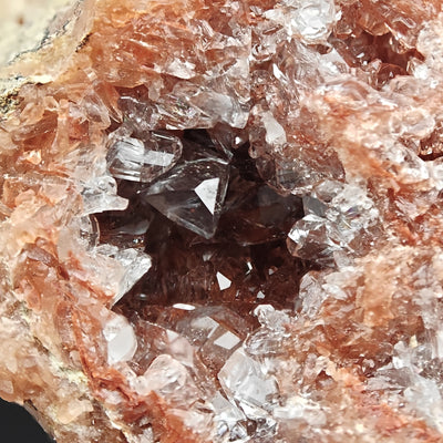 Celestine crystals lining a geode pocket with orange hematite coating, Turkmenistan