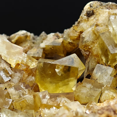 Detail of translucent golden fluorite crystals on matrix from Hilton Mine, England
