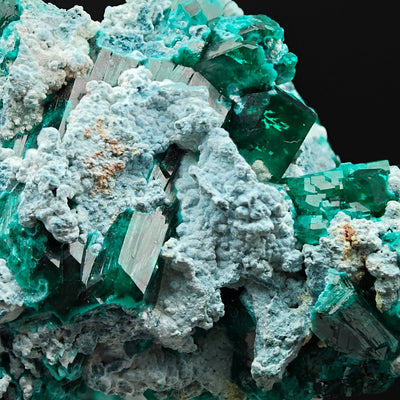 Close-up of elongated green Dioptase crystals with blue Shattuckite coating