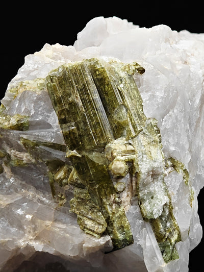 Detail of striated lepidolite after tourmaline pseudomorph crystal on quartz, Minas Gerais