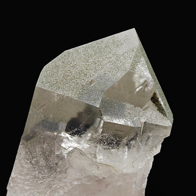Detail of chlorite-included smoky quartz termination showing internal reflections