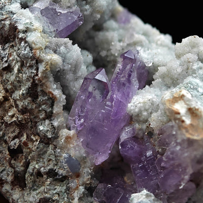 Amethyst crystals with pointed terminations on Calcite, Capurru Quarry, Osilo