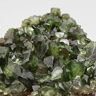 Dense aggregate of vivid green Ludlamite crystals on matrix, Amazonas