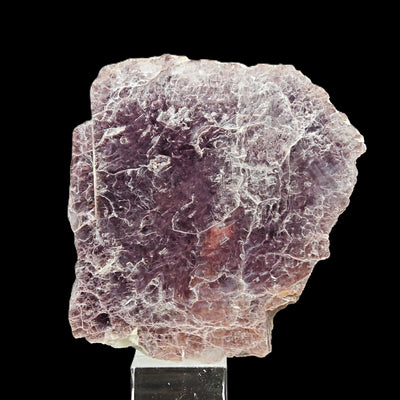 Full view of lepidolite specimen on display stand, Minas Gerais, Brazil