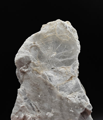 Close-up of transparent selenite crystal faces with fibrous sheen